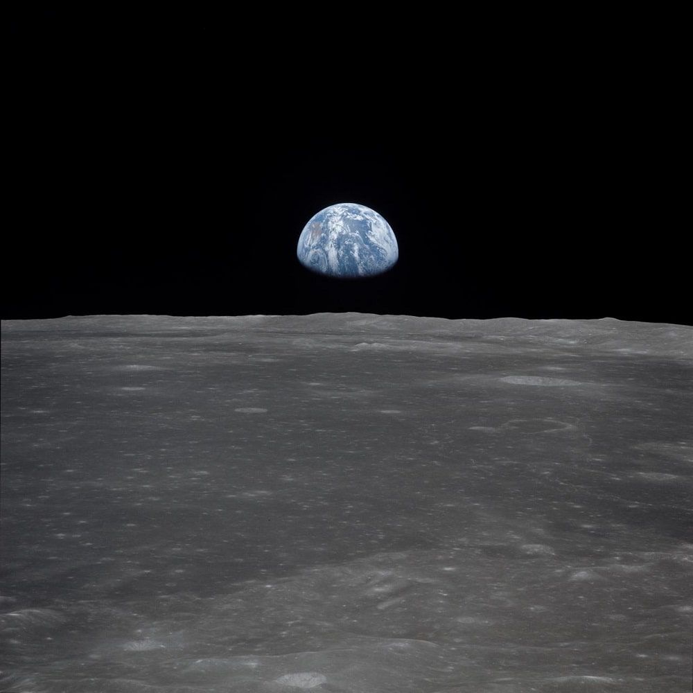 Apollo 11 Mission image - View of moon limb,with Earth on the ho
