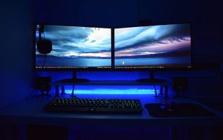 two computer flat screen monitors turned on